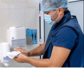 health worker washing hands